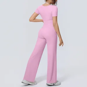 Back view of a pink short-sleeve yoga top and wide-leg pants set for women's active sports.