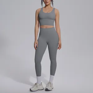 High-waist gray yoga set featuring V-neck sports bra and seamless leggings for gym workout