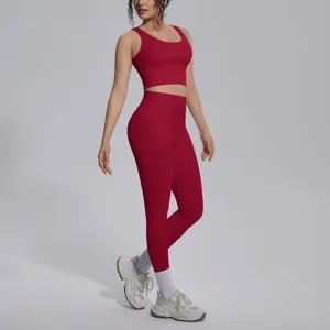 Two-piece red yoga set featuring a V-neck sports bra and high-waisted gym leggings