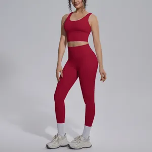 Red two-piece yoga set with V-neck sports bra and high-waisted leggings on model