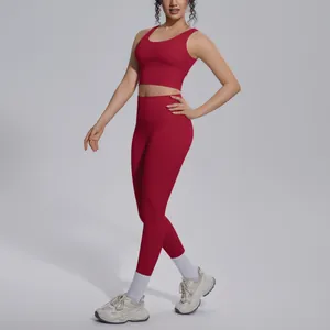 Professional red seamless yoga set featuring high-waisted leggings and a supportive sports bra.