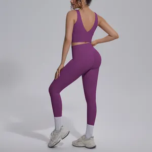 Back view of purple high-waist yoga set featuring a V-neck sports bra and leggings