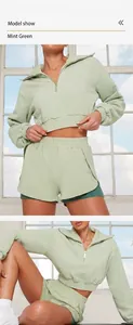 Détail du sweat-shirt de sport à manches longues vert clair et du short faux deux pièces