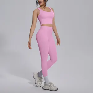Two-piece pink naked feel yoga set including sports bra and high waisted leggings