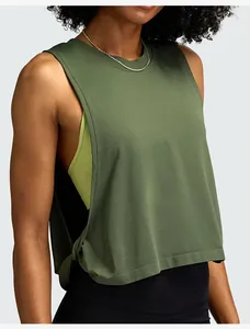 Side view detail of a loose green sleeveless yoga tank top for women's fitness.