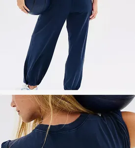 Detail view of navy blue sleeveless top and joggers tracksuit set with pockets