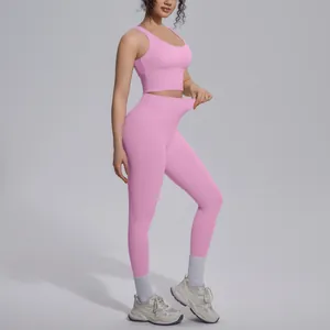 Detail shot of stretchy high-waisted pink leggings from a two-piece yoga set