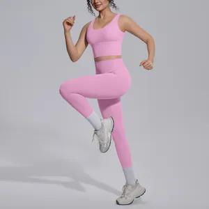 Women's pink yoga set featuring a V-neck sports bra and high-waist leggings in action.