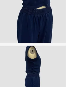 Detail shot of navy sleeveless top and elastic waist pants on mannequin.