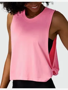 Detailed view of women's loose pink workout tank top for yoga and fitness training