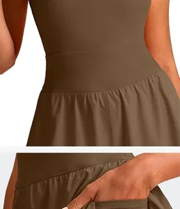 Detail view of a brown athletic tennis dress with a high waistband and side pocket