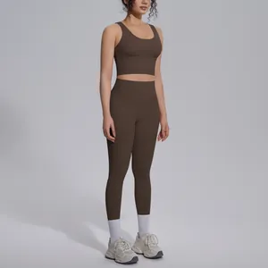 Two-piece chocolate brown yoga set with sports bra and high-waisted leggings