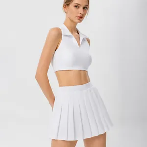 Completo da tennis polo senza maniche bianco da donna con gonna a pieghe