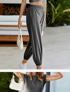 Close-up of women's grey casual two-piece set with sleeveless top and jogger pants.