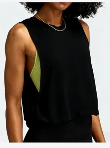 Loose sleeveless workout tank top cover-up for women showing layered sports bra detail