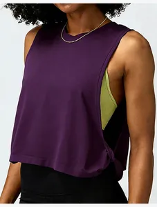 Detail shot of women's purple loose sleeveless sports yoga tank top for workout
