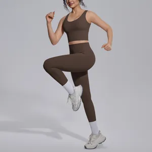 Model wearing chocolate brown V-neck sports bra and high-waisted leggings set in running pose.