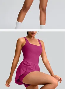 Detailed view of magenta sleeveless athletic tennis dress with flared skirt and inner shorts