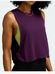 Close-up detail of the deep armhole design on a loose purple yoga cover-up tank top.