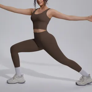 Model wearing a brown nude-feel yoga set with a V-neck sports bra and high-waist leggings