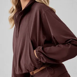 Women's burgundy half-zip athletic sweatshirt set with high collar for gym running