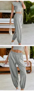 Detailed view of grey two-piece casual set with crop top and pocket joggers
