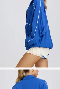Detailed side and back view of a blue half-zip stand collar breathable sports jacket for women