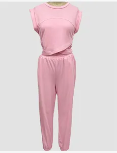 Detail view of pink two-piece leisure set with sleeveless top and jogger pants on mannequin.