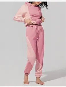 Tuta sportiva da donna con cappuccio e pantaloni jogger rosa a blocchi di colore