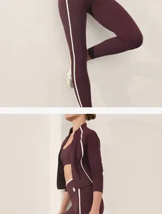 Detailed macro view of the plum yoga set featuring white side stripes for women's fitness.