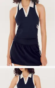 Detail of navy blue and white color-block polo yoga tank top and tennis skirt set