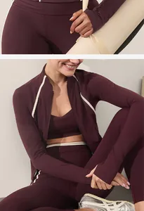 Close-up detail showing the texture and white trim of this maroon yoga workout set.