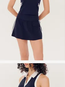 Detailed view of navy blue yoga vest with polo collar and matching tennis skirt set