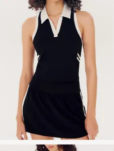 Close-up of black and white contrast polo sports set with tennis skirt