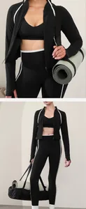 Detailed view of women's black and white yoga set with jacket and leggings gym outfit