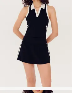 Professional two-piece color-blocking tennis set featuring a sleeveless polo top and mini skirt