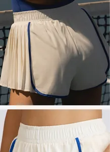 Primer plano de la cintura elástica alta y el detalle plisado en el short deportivo