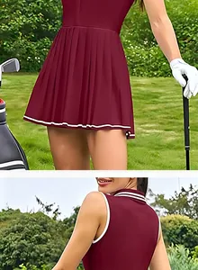 Detailansicht des Faltenrock-Saums und des Kontrast-Polokragens am burgunderroten Kleid.