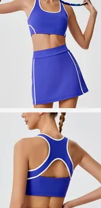 Detailed view of blue tennis set showing backless sports bra and high-waisted skirt.
