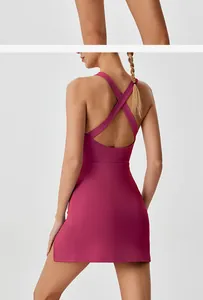 Back view of magenta quick-dry sports dress with cross-back straps and side slit