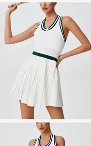 Elegant white pleated tennis dress featuring green stripe trim and a front zipper detail