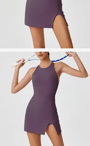 Close-up detail of purple sports dress featuring side slit and stylish open back design