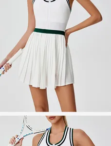 Detail of white pleated tennis skirt and matching contrast trim athletic zip top