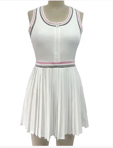 Detailed view of white zip-up tennis dress with pleated skirt and striped trim details