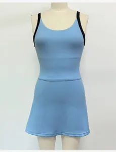 Front view detail of a light blue tennis dress with black contrast straps on a mannequin