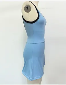 Side view of light blue quick-dry women's tennis dress with black trim on mannequin