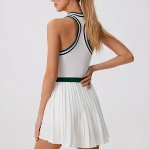 Stylish white racerback tennis dress with pleated skirt and green trim for women