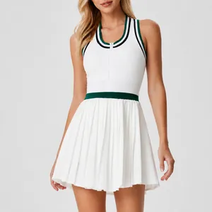 Athletic white tennis dress featuring a front zipper high waist and pleated skirt detail