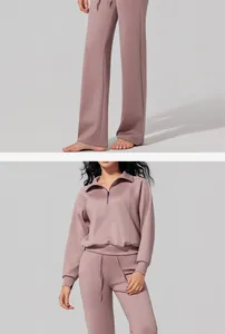 Detailed view of women's half-zip mauve sports set with high-waist pants