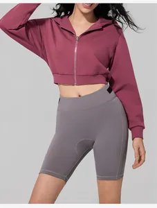 Women's burgundy cropped zip-up hoodie with hood and zipper detail on grey background